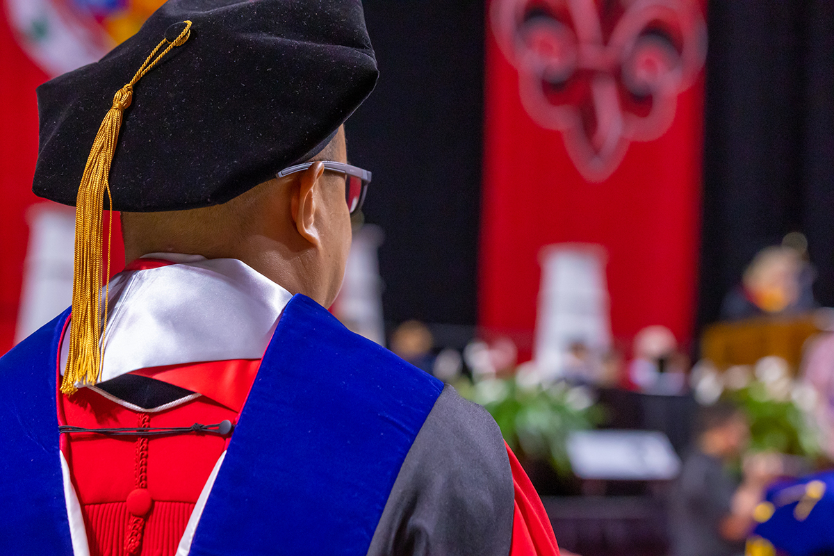 A doctoral student at commencement